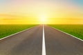 Asphalt street road to infinity highway with golden sky in background. Royalty Free Stock Photo