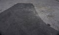 Asphalt tarmac patch on concrete ground repair pavement road in parking lot Royalty Free Stock Photo