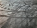 asphalt with tire marks, drifting cars, road, patterns, circles, black color Royalty Free Stock Photo