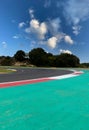 Asphalt turn track on motorsport circuit with large green trap area