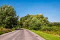 Asphalth third grade curved Slovak countryside road near forest, summer