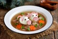 Aspic with meat, pork jelly is a festive traditional Russian dish decorated with boiled eggs in the form of cute pigs. Royalty Free Stock Photo