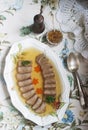 Aspic of the tongue decorated with boiled carrots and parsley on a festive background. Rustic style