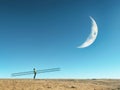 Man holding a ladder an looks up to the moon Royalty Free Stock Photo