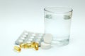 Aspirin/paracetamol and a glass of water Royalty Free Stock Photo