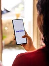 Samsung logo on a phone screen stock image.