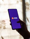 Assam, india - August 27, 2020 : NSE logo on phone screen stock image.