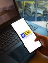 Assam, india - December 20, 2020 : LIC logo on phone screen stock image.