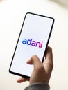 Assam, india - January 15, 2020 : Adani logo on phone screen stock image.