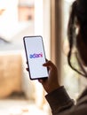 Assam, india - January 15, 2020 : Adani logo on phone screen stock image.