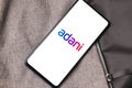 Assam, india - January 15, 2020 : Adani logo on phone screen stock image.