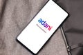 Assam, india - January 15, 2020 : Adani logo on phone screen stock image.