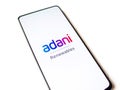 Assam, india - January 15, 2020 : Adani logo on phone screen stock image.