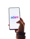 Assam, india - January 15, 2020 : Adani logo on phone screen stock image.