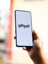 Assam, india - May 18, 2021 : Giffgaff logo on phone screen stock image.