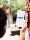 Assam, india - May 18, 2021 : Giffgaff logo on phone screen stock image.