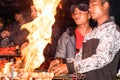 Assam, India May 6: A man preparing Shish kebab on barbecue grill over charcoal. Roast Beef on BBQ Grill. Marinated Shashlik Royalty Free Stock Photo