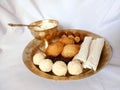 Assamese traditional food items like pitha, laddu, doi sira with assamese gamosa background