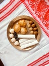 Assamese traditional food items like pitha, laddu, doi sira with assamese gamosa background
