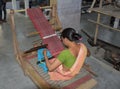 Assamese woman weaver working on loom