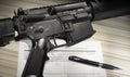 Assault rifle with public domain FBI Background check form