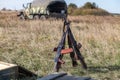 Assault rifles folded in the shape of a hut on the battlefield Royalty Free Stock Photo