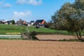 Asse ter Heide, Flemish Brabant - Harvested farmland and residential houses at the Flemish countryside