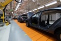 Assembled car is on the Assembly line. Robotic equipment makes the Assembly of the car. Modern car Assembly at the