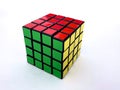 Colored rubik`s cube with faces of red, green, yellow colors on a white background