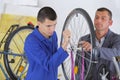 Assembling the bike`s tire Royalty Free Stock Photo