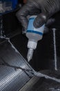 Assembling 3D printed parts with cyanoacrylate glue. Using a syringe for precision. Royalty Free Stock Photo