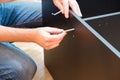 Assembling furniture. Furniture Assembly Worker Assembles Shelf. Service man assembling furniture for customer, Delivery service Royalty Free Stock Photo