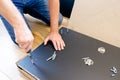 Assembling furniture. Furniture Assembly Worker Assembles Shelf. Service man assembling furniture for customer, Delivery service Royalty Free Stock Photo