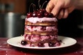 assembling gateau with cherry filling