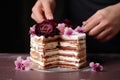 assembling gateau with cream layers