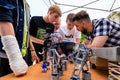 Assembling a robot in the club of robotics and cybernetics. June 1, 2022 Balti, Moldova. Illustrative editorial