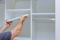 Assembling shelves for closet cabinet with home a new apartment Royalty Free Stock Photo