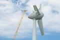 Assembling wings Dutch windturbine with large crane Royalty Free Stock Photo