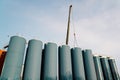 Assembly of a brewery tanks for storage barley or fermented beer using telescopic boom crane Royalty Free Stock Photo