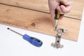 Assembly of cabinet furniture, installation of furniture accessories using tools Royalty Free Stock Photo