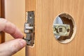 Assembly of door handle and installation lock with latch