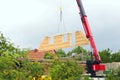 Assembly of a prefabricated timber house, horizontal picture