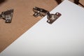 Assembly of wooden furniture, metal hinge on the white cabinet door of the kitchen unit. Carpenter services Royalty Free Stock Photo