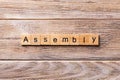 ASSEMBLY word written on wood block. ASSEMBLY text on wooden table for your desing, concept Royalty Free Stock Photo
