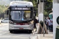 Assengers board a bus at a stop at Juscelino Kubitschek avenue