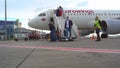 assengers are traveling. Arrival at the airport. Flight. Eurowings plane. Many people in masks and with suitcases travel