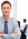 Assertive businessman standing in front of his tea