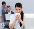 Assertive Businesswoman drinking a coffee