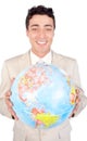 Assertive executive holding a terrestrial globe Royalty Free Stock Photo