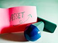 asset bussiness finance text displayed on pink paper slip with stamp seal isolated Royalty Free Stock Photo